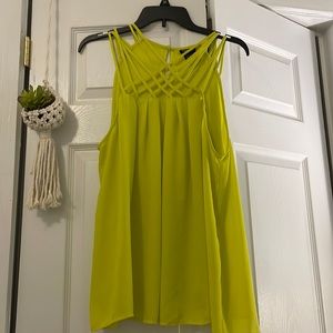 NWOT Sz. 00  precious Torrid lemon yellow top with button closure in back.